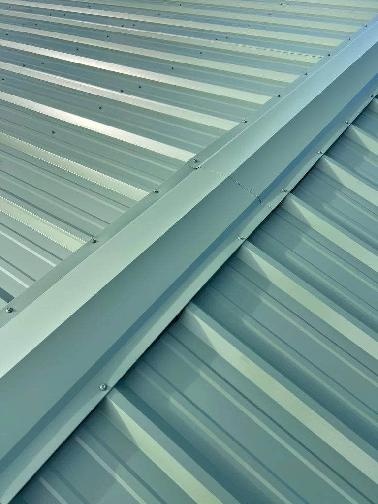 Exposed fastener green metal roof reimagine roofing scaled