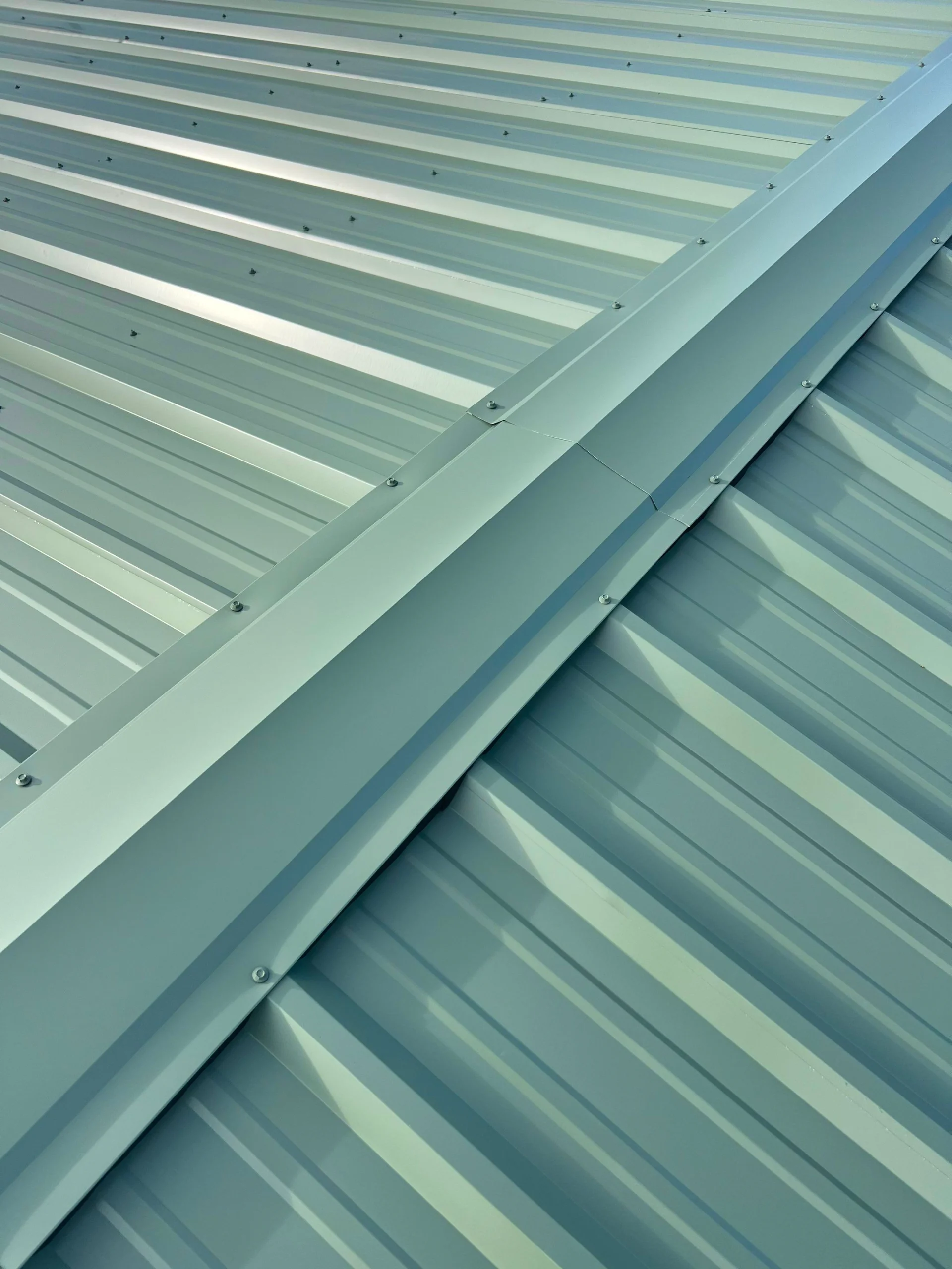 Exposed fastener green metal roof reimagine roofing scaled