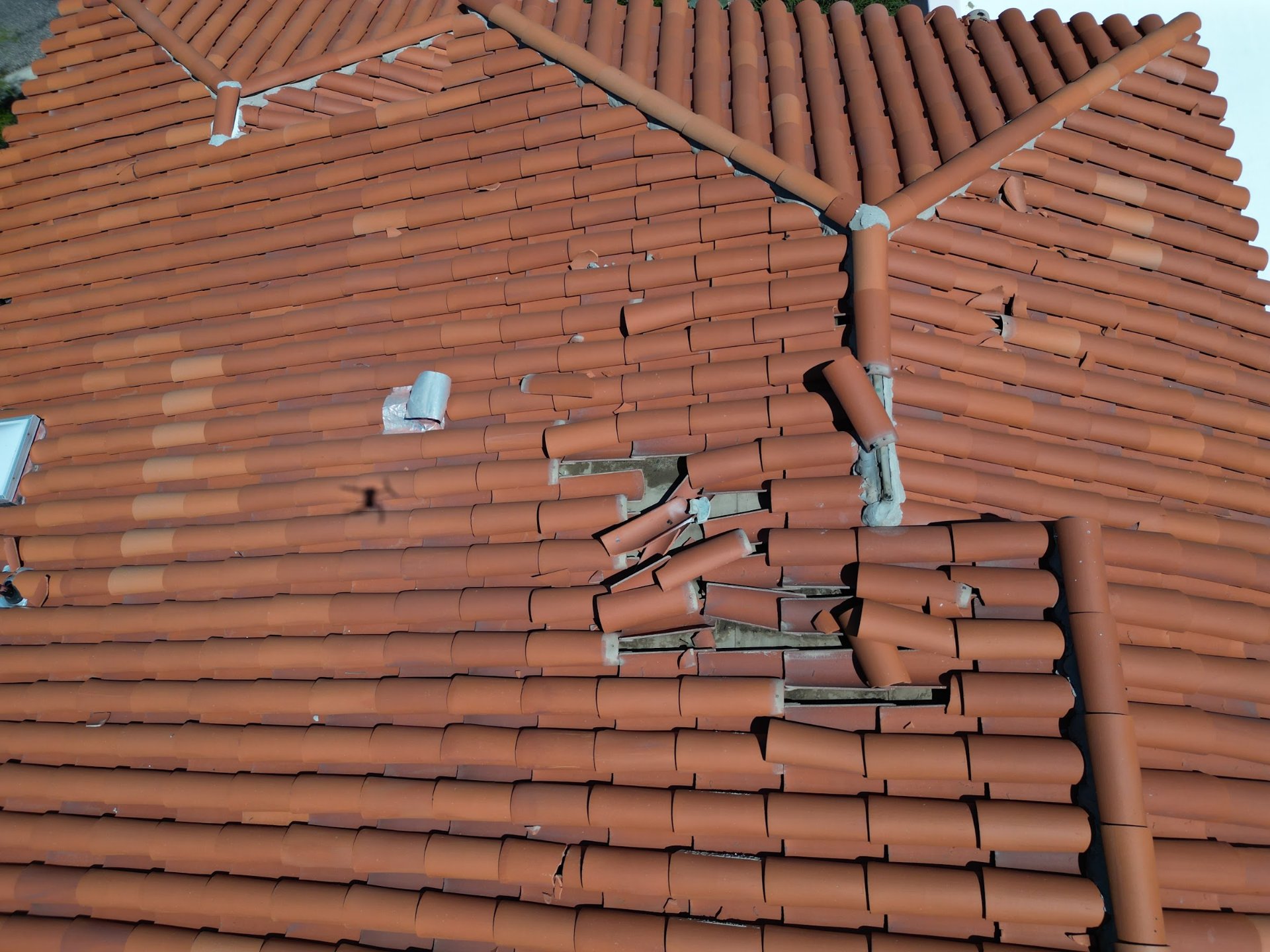 Close-up of broken clay roof tiles on an Arizona home